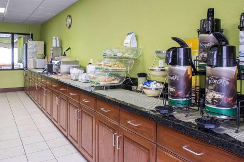 a kitchen with a counter with alot of food at Quality Inn & Suites Sioux City Southeast in Sioux City