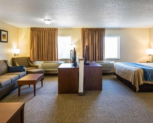a hotel room with a bed and a couch at Quality Inn in Lewiston