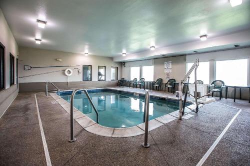 a pool in a hotel room with a swimming pool at Quality Inn & Suites Mendota near I-39 in Mendota