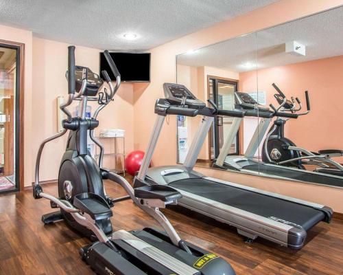 a gym with three exercise bikes in a room at Quality Inn Morton at I-74 in Morton