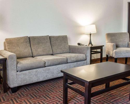 a living room with a couch and a coffee table at Sleep Inn O'Fallon near I-64 in O'Fallon