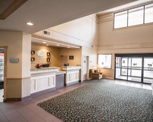 a large lobby with a waiting area with a window at Comfort Suites University Area Notre Dame-South Bend in South Bend
