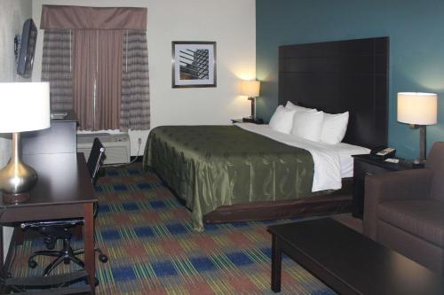 a hotel room with a bed and a couch at Quality Inn North Vernon near Hwy 50 in North Vernon