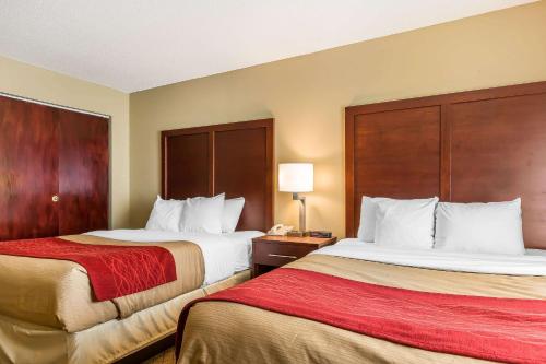 a hotel room with two beds and a telephone at Comfort Inn & Suites Mishawaka-South Bend in South Bend