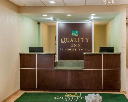 a view of a waiting room with a mirror at Quality Inn in Huntingburg