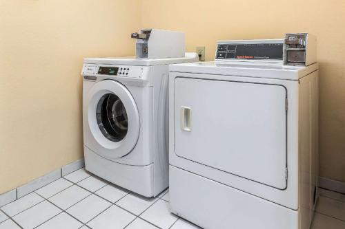 a white washer and dryer in a room at Comfort Inn & Suites Mishawaka-South Bend in South Bend