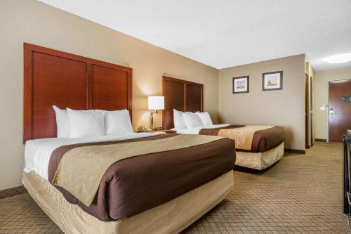 a hotel room with two beds in a room at Comfort Inn & Suites Mishawaka-South Bend in South Bend