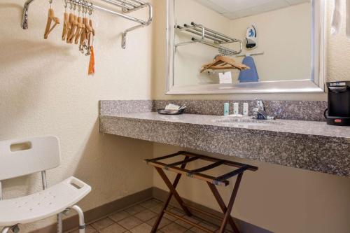 a bathroom with a sink and a mirror at Quality Inn in Huntingburg