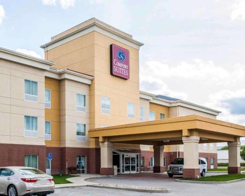 a hotel with a car parked in front of it at Comfort Suites near Indianapolis Airport in Indianapolis