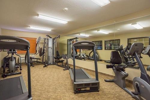 a gym with several treadmills and exercise bikes at Suburban Studios Clarksville-Louisville North in Clarksville