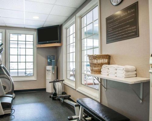 a waiting room with a chair and a table with towels at Comfort Inn & Suites Sturbridge-Brimfield in Sturbridge