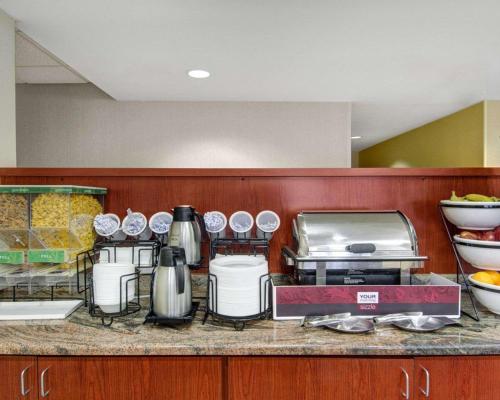 a kitchen counter with a bunch of food at The Inn At Woburn - Boston in Woburn