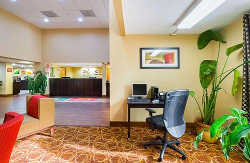 an office with a desk with a computer and plants at Quality Inn & Suites in Hagerstown