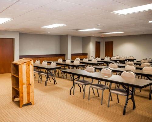 an empty room with tables and chairs in it at Sleep Inn & Suites Hagerstown in Hagerstown