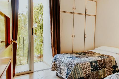 Een bed of bedden in een kamer bij Villa Niagara