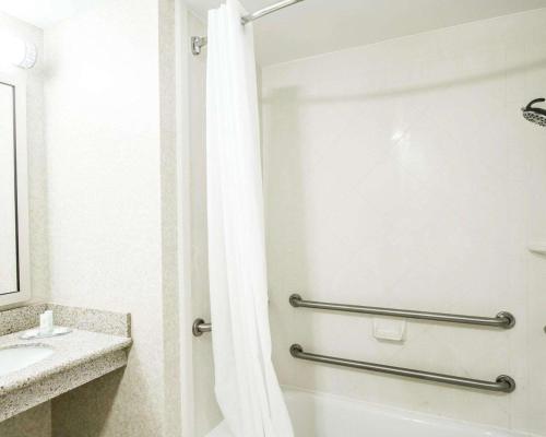 a bathroom with a shower and a sink at Comfort Inn & Suites Scarborough in Scarborough