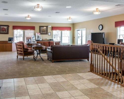a living room with a couch and a table and a tv at Mountain Run at Boyne in Boyne Falls