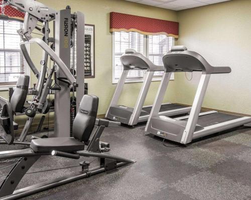 a gym with three tread machines in a room at Mountain Run at Boyne in Boyne Falls