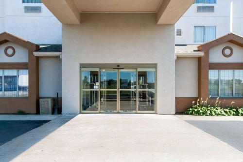 a building with a glass door in front of it at Sleep Inn in St. Charles