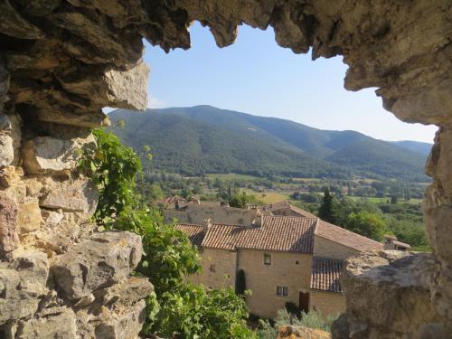 a view of a village from a castle window at Le Mas des Restanques in Le Poët-Laval