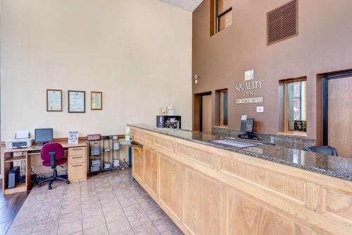 a bar in a dental office with a counter at Quality Inn West in Branson