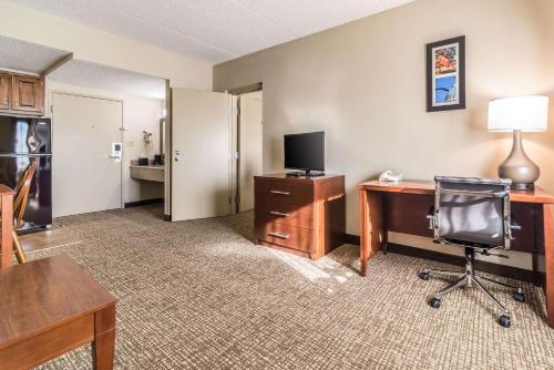 a room with a desk with a computer and a chair at Comfort Inn Festus-St Louis South in Festus