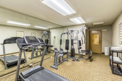 a gym with several tread machines in a room at Quality Inn Rolla in Rolla