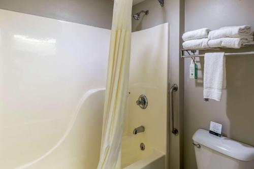 a bathroom with a shower and a toilet at Quality Inn in Rolla