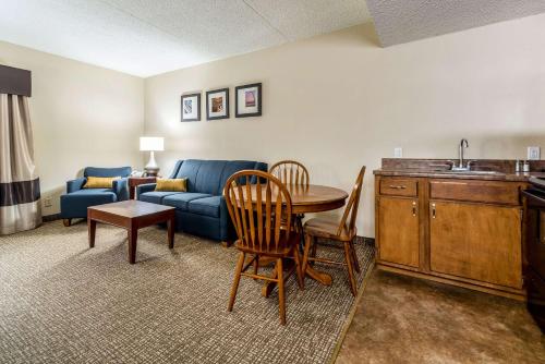 a living room with a couch and a table at Comfort Inn Festus-St Louis South in Festus