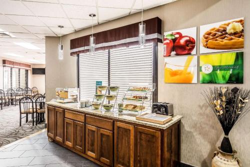 a restaurant with a counter with food on it at Quality Inn in West Plains