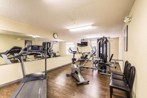 a gym with treadmills and elliptical machines at Quality Inn in West Plains