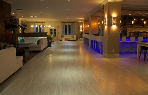 a large lobby with a bar in a hotel at White House Hotel in Biloxi