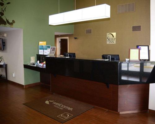 an office with a reception desk and a cash counter at Sleep Inn Horn Lake-Southaven in Horn Lake
