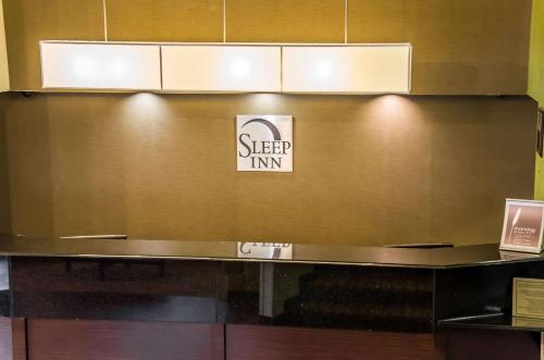 a counter in a room with a sign on a wall at Sleep Inn Matthews-Charlotte in Charlotte