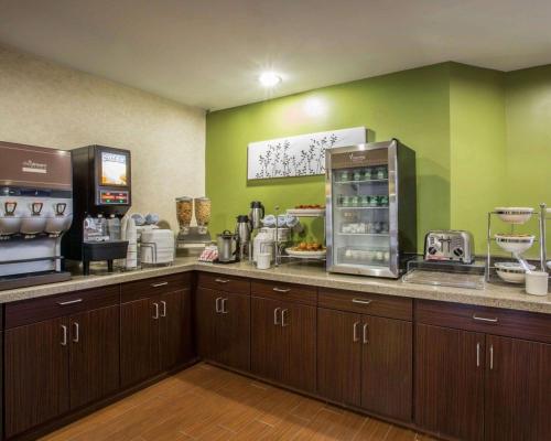 a kitchen with a counter with aasteryasteryasteryasteryasteryasteryasteryasteryastery at Sleep Inn Asheville - Biltmore West in Asheville