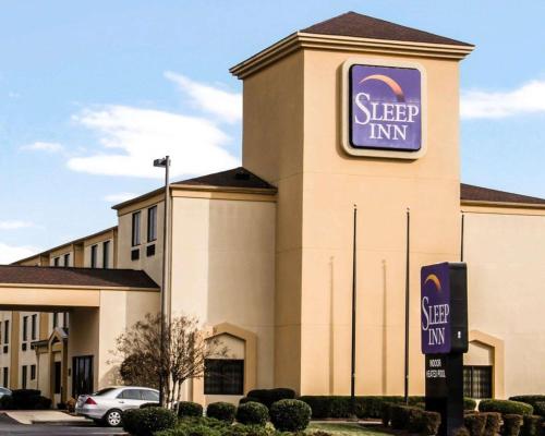 a sleep inn sign on the side of a building at Sleep Inn Concord - Kannapolis in Kannapolis