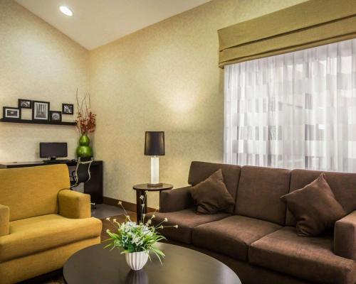 a living room with a couch and a table at Sleep Inn Asheville - Biltmore West in Asheville