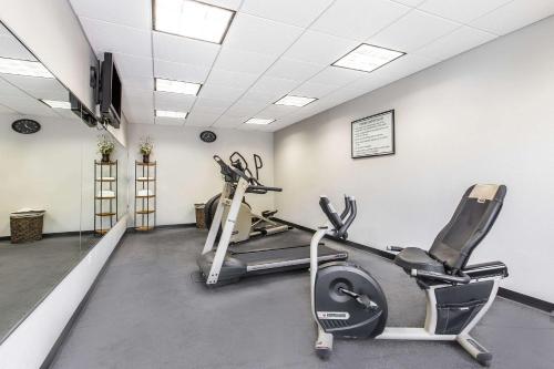 a gym with two exercise bikes in a room at Clarion Inn Biltmore Village in Asheville
