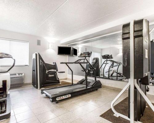 a gym with two tread machines in a room at Quality Inn & Suites Coliseum in Greensboro