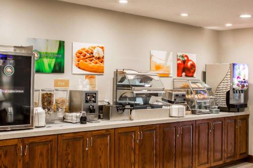 a fast food restaurant with a counter with food at Quality Inn Fuquay Varina East in Fuquay-Varina