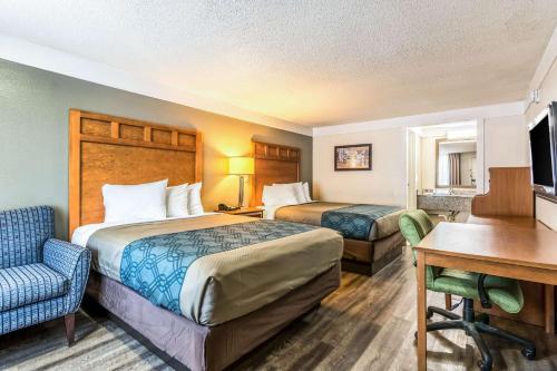 En eller flere senge i et værelse på Econo Lodge - Gastonia
