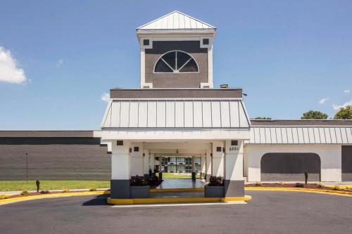 a large building with a clock tower on top at Quality Inn & Suites University Area in Charlotte