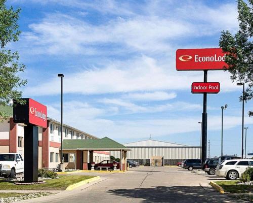 a sign in a parking lot in front of a hotel at Econo Lodge in Fargo
