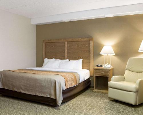 A bed or beds in a room at Quality Inn Bismarck