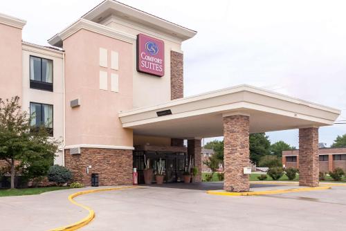 a hotel with a sign on the front of a building at Comfort Suites East Lincoln - Mall Area in Lincoln