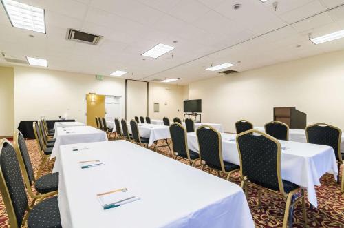 a conference room with white tables and chairs at Quality Inn & Suites in Ogallala
