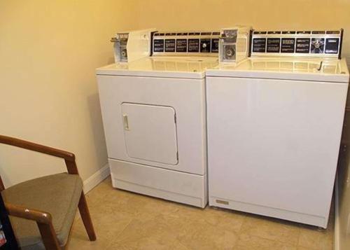 two refrigerators are sitting next to each other in a room at Rodeway Inn Lincoln I-93 in Lincoln