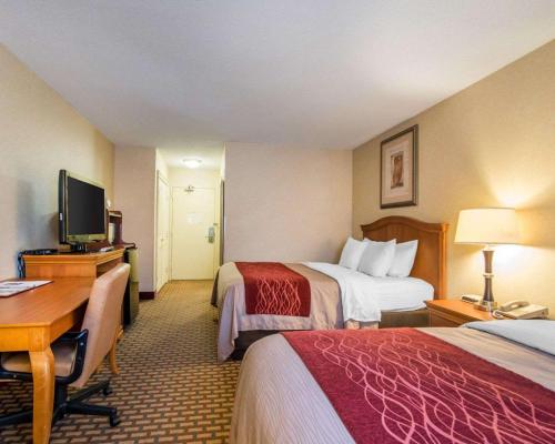Ένα ή περισσότερα κρεβάτια σε δωμάτιο στο Quality Inn