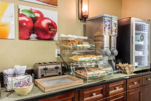 a kitchen with a counter with some food on it at Quality Inn near Mountain Creek in Vernon