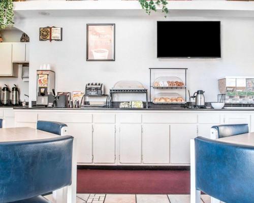 a restaurant with a counter with food on it at Econo Lodge Las Cruces University Area in Las Cruces
